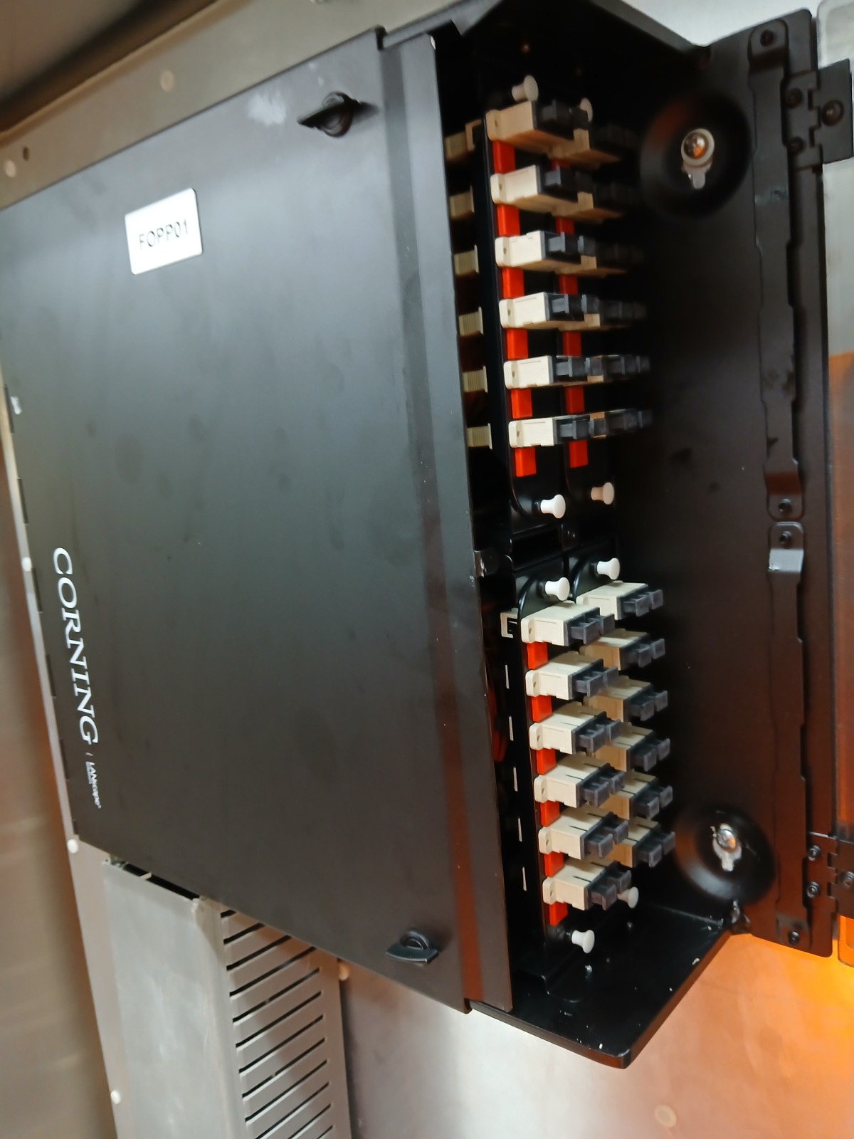 Fiber distribution panel installed in a network cabinet